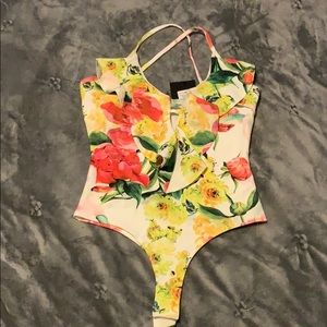 Floral ruffle front bodysuit.